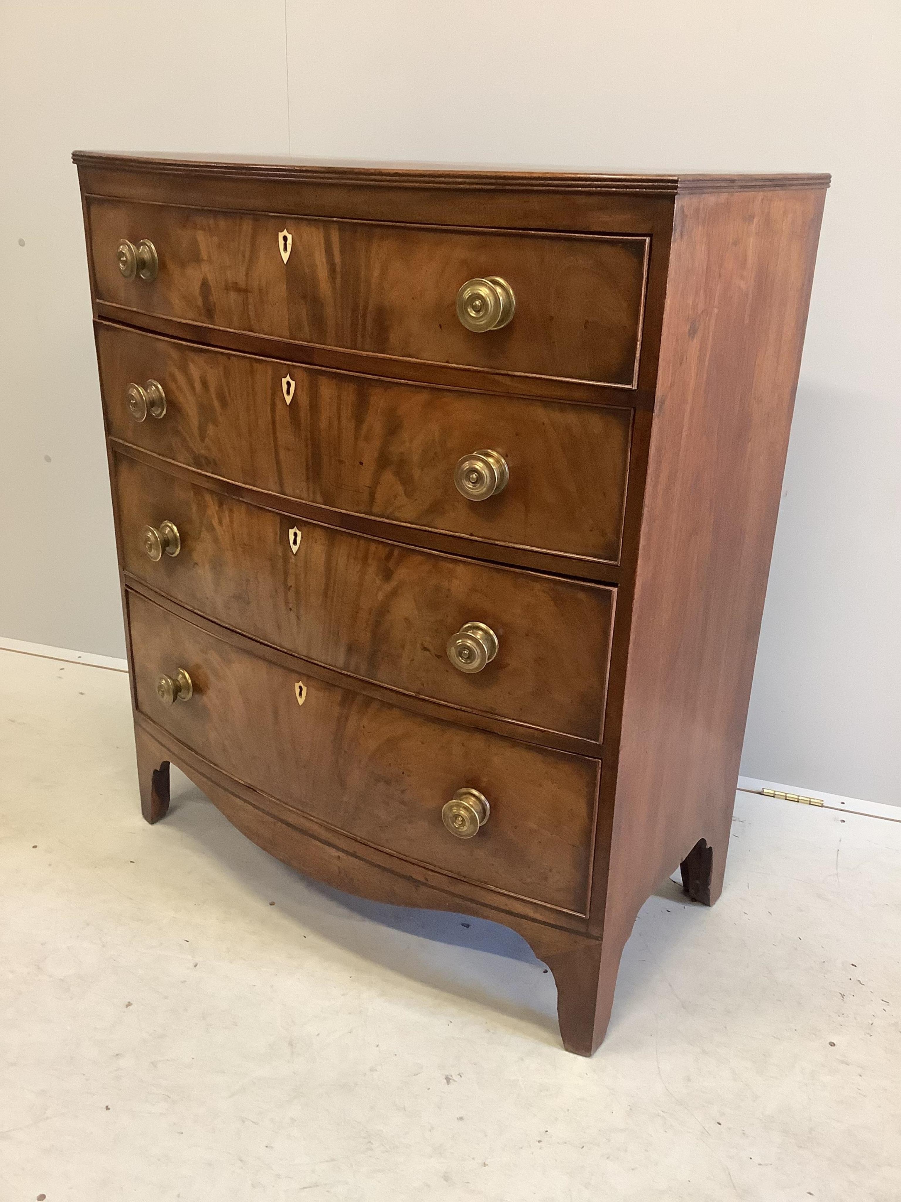 A Regency rosewood banded mahogany bowfront chest of drawers, width 90cm, depth 48cm, height 107cm. Condition - good